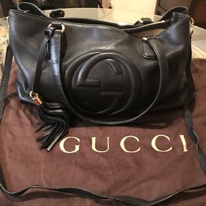 Black Gucci shoulder and crossbody bag with tassel